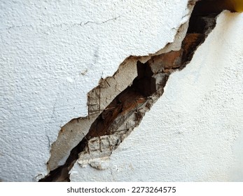 cracked concrete wall  the impact of landslides, earthquakes, geology, low-standard construction