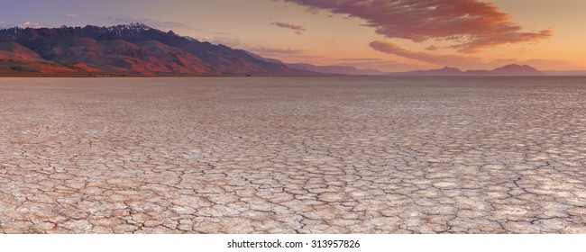 Cracked earth in the Alvord Playa, a dry lakebed in the Alvord Desert in southeastern Oregon, USA. Photographed at sunrise.