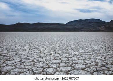Cracked earth from dry lake bed shows severe drought conditions in remote part of Oregon named Alvord Desert.