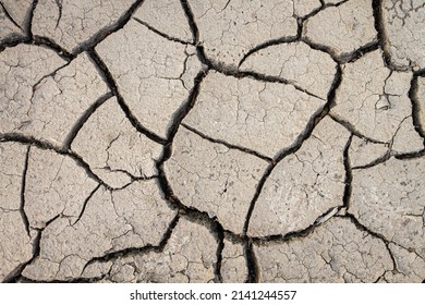 Cracked earth from dry reservoir bed.