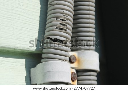 Cracked electrical conduit pipe damaged by UV sun exposure