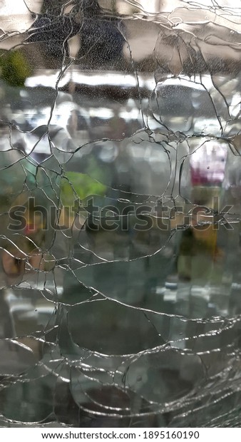 Cracked glass\
background. Cracked glass\
surface