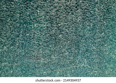 Cracked glass texture background. Broken tempered glass with cracks, shattered window pattern, chapped transparent surface wallpaper, safety shards mockup - Shutterstock ID 2149304937