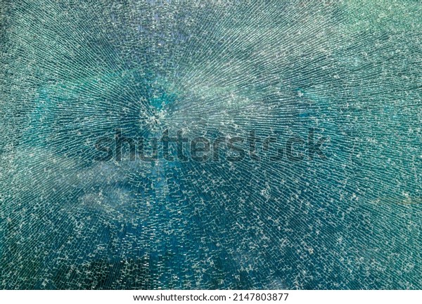 Cracked glass texture background.
Broken tempered glass with cracks, shattered window pattern,
chapped transparent surface wallpaper, safety shards
mockup