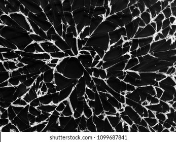 Cracked glass texture on black background. Isolated realistic cracked glass effect.