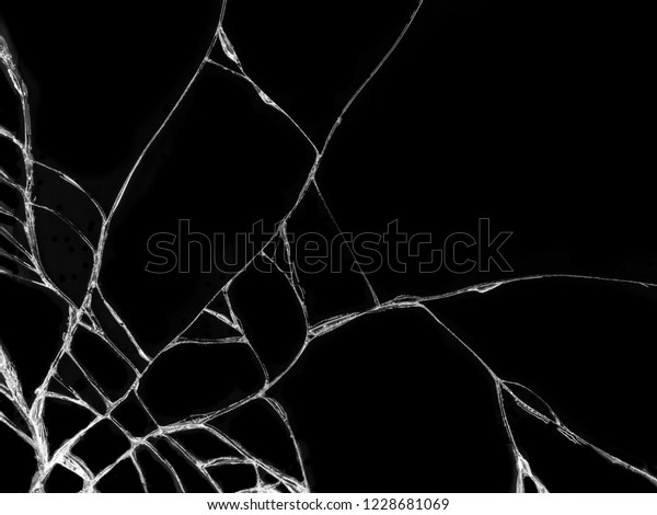 Cracked glass texture on black background.\
Isolated realistic cracked glass\
effect.