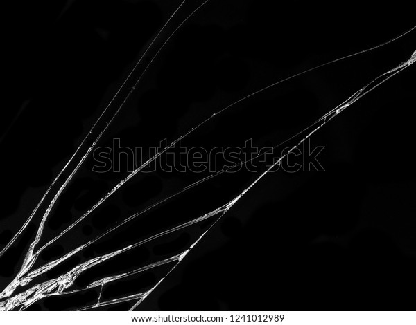 Cracked glass texture on black background.\
Isolated realistic cracked glass\
effect.