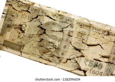 Cracked Indian currency isolated on white background - Shutterstock ID 1182096034
