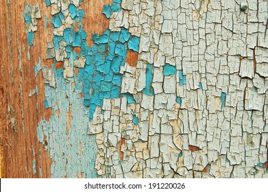 Cracked paint on a wooden wall. grunge background. Blue and white colors on wood
