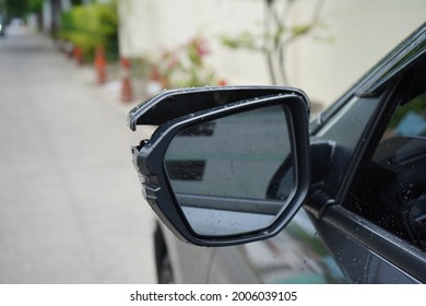 Cracked Rear View Mirror On A Grey Car. Rearview Mirror Has Broken From Car Accident. Side View Damage. Grey Color Car Damaged And Broken By Accident On Road. Insurance Claim.