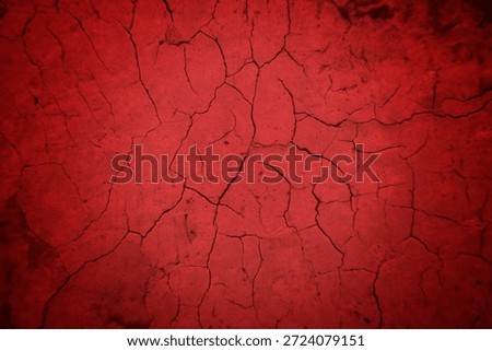 Cracked Red Wall Texture With Deep Fissures And Subtle Shadows For Background Design