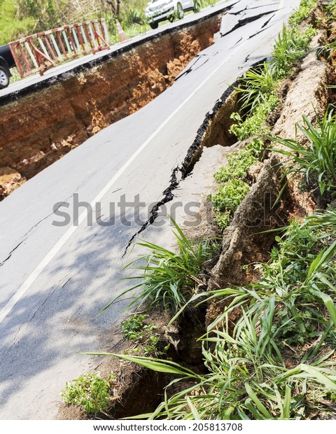 Cracked road after earthquake at Chiang Rai\
Province, Thailand