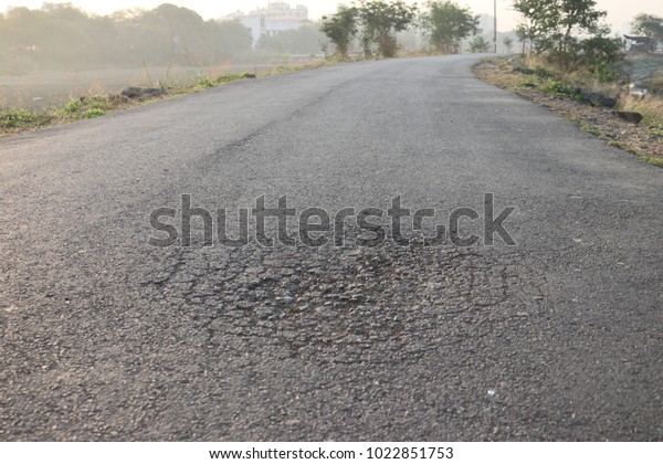 Cracked road, damaged asphalt\
road