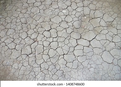 Cracked Soil In Drought And Dry Season In Rural Area. Soil Restore Is Needed To Develop The New Soil Food Web For Sustainable Farming And Planting