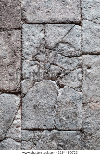 cracked stone blocks, antique tiled stone floor / wall
with cracks -