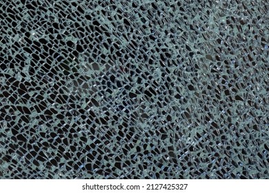 Cracked Tempered Glass With Cracks Pattern. Vandalism, Destruction Concept. Broken Glass Due To Crime, Robbery Of Shop Concept.