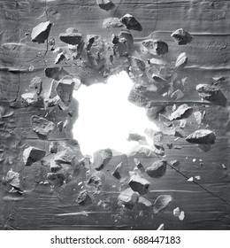 cracked wall with explosion hole and debris