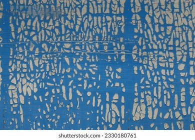 Cracked and weathered plastic wrap on metal surface. Abstract shapes grungy background.
