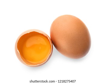 Cracked And Whole Chicken Eggs On White Background, Top View