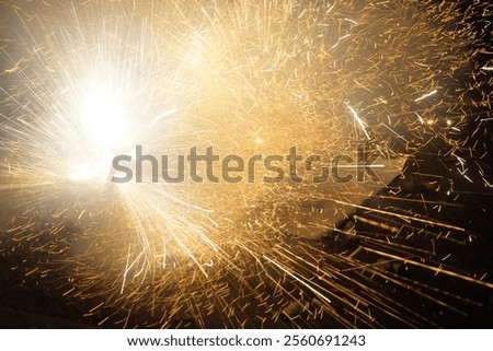 Cracker exploding with fire in ground on Diwali night.
