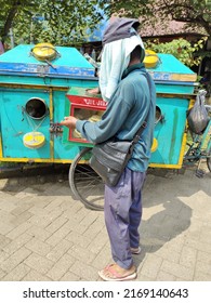 A Cracker Seller Stand Next To The Tricycle Mobile Cracker Pedicab Cart