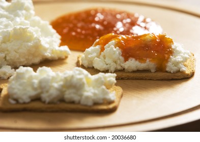 crackers with cheese and jam