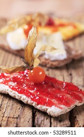 Crackers with jam and cheese 
