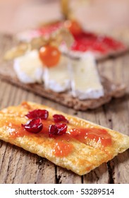 Crackers with jam and cheese 
