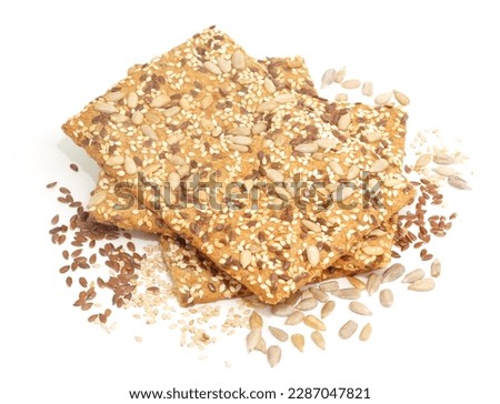 Crackers with seeds on white background, isolated.