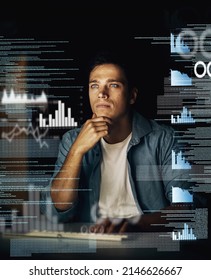 Cracking codes is not just his job but his passion. Cropped shot of a young computer programmer looking through data in the dark.