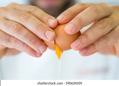 Cracking egg close-up - Powered by Shutterstock