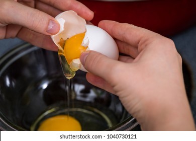 Cracking An Egg Into A Bowl