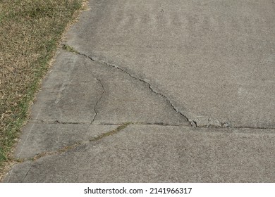 Cracks In A Concrete Footpath At An Expansion Joint.