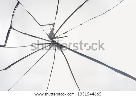 Cracks in the glass. Failure and problem symbol. Life has cracked. Broken mirror on a black background.
