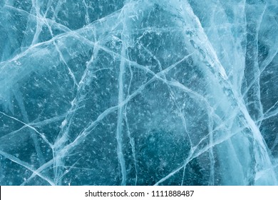 Cracks In The Ice. Frozen Lake Surface.