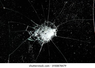 cracks on black glass background, broken abstract glass hole destruction concept - Shutterstock ID 1930878479
