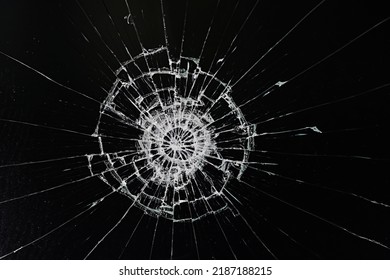 cracks on the glass impact on the glass, abstract background broken window damage - Powered by Shutterstock