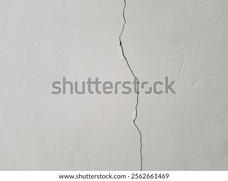 cracks in the wall due to using building materials that do not match the proportions of cement, sand and water