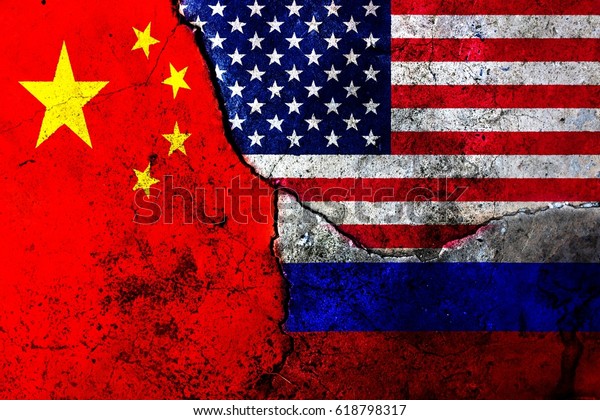 Cracks in the\
wall. Flags: USA, Russia,\
China