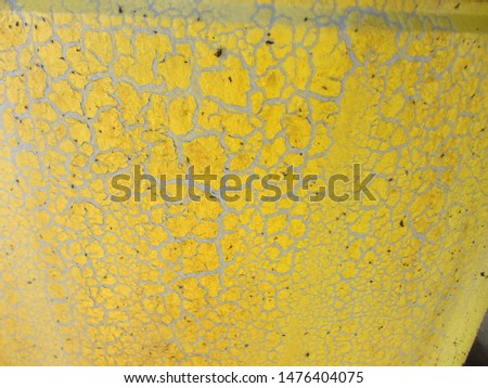 Cracks in the yellow paintwork. Protective coating defect