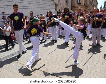 Cracow, Malopolska, Poland - 06.02.2019: The yougsters of the school of capoeira perform during the Dragons Parade, the annual event in the center of Old Town.