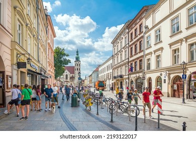 Cracow, Poland - 23 July 2022:  People Walking On A Street. Krakow, Old Town Near Main Square, Poland