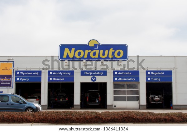 CRACOW, POLAND - APRIL 11, 2018.\
Norauto logo on a wall. Norauto is a car service station network\
consisting of a self-service automotive store and a car\
service