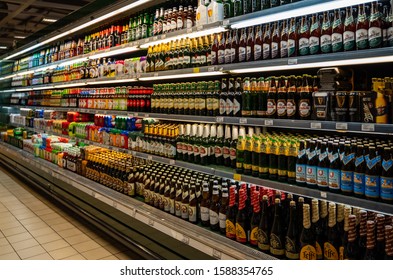 Cracow, Poland - December 12, 2019: Liquor Store And Markets Beer Supply. Shelves Full Of All Kind Of Beers: Imported, Dark, Craft, Pils, Lager, Wheat.