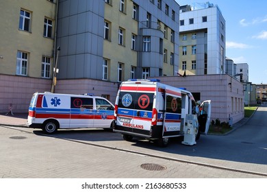 Cracow, Poland - May 2022: A Facade Of A Building Of The Gabriel Narutowicz Hospital And A Driveway To A Hospital Emergency. Selected Focus.