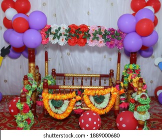 Cradle Decorated With Flowers And Baloons For Naming Ceremony Of Baby In Maharashtra