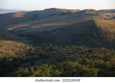 Cradle of Humankind Landscape with Trees and Mountains - Shutterstock ID 2221519559