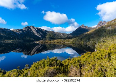 Cradle Mountain on clear day reflected in Dove Lake. Cradle Mountain - Lake St Clair National Park, Tasmania, Australia - Shutterstock ID 392502694