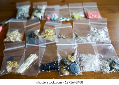 Craft And Beading Supplies Packaged Into Small Plastic Pouches. 