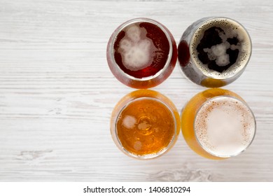 Craft Beer Assortment On A White Wooden Table, Top View. Overhead, From Above, Flat Lay. Copy Space.